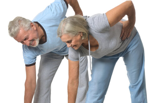 couple bending over exercising